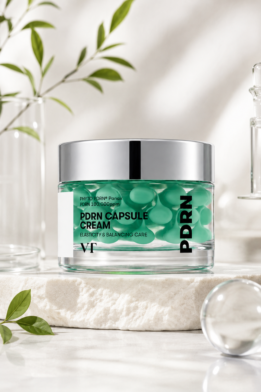 VT Cosmetics PDRN Capsule Cream 100 50ml elegantly displayed on a premium natural stone pedestal in a bright minimalist skincare setting with soft daylight, delicate botanical accents, laboratory-inspired glassware and crystal-clear décor, highlighting its innovative visible capsule technology, regenerative PDRN formula and luxurious Korean skincare aesthetic for healthy, resilient and glowing skin.