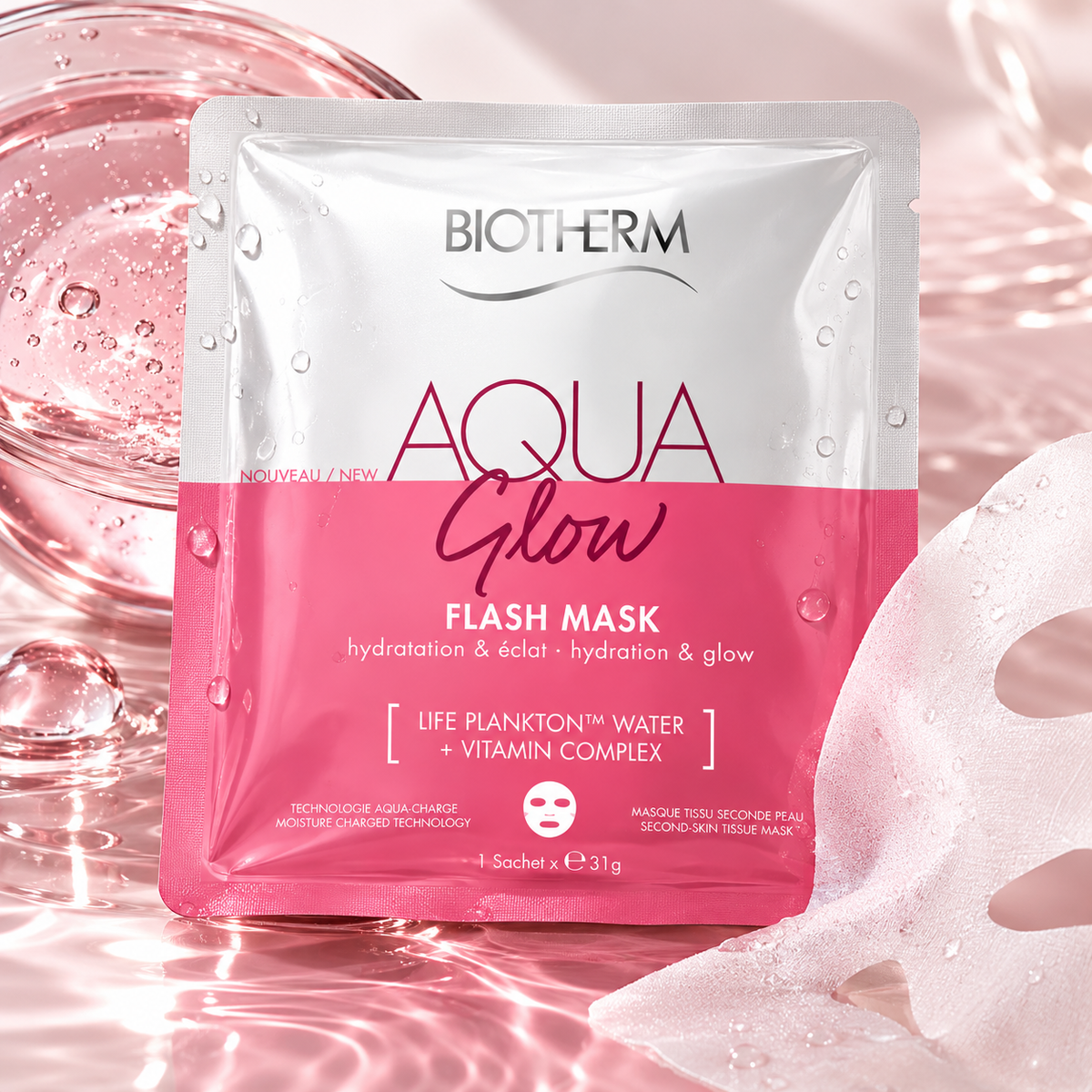 Biotherm Aqua Glow Flash Mask hydrating and glow sheet mask displayed in a fresh pink skincare setting with water droplets, glossy textures and a soft sheet mask beside the sachet.